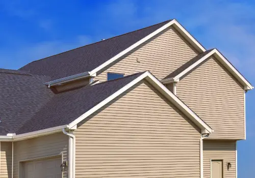 a house with a roof and a garage