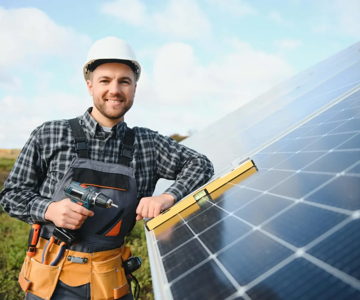 a-handyman-standing-on-the-rooftop-with-solar-pane-2024-02-15-19-43-41-utc a-handyman-standing-on-the-rooftop-with-solar-pane-2024-02-15-19-43-41-utc