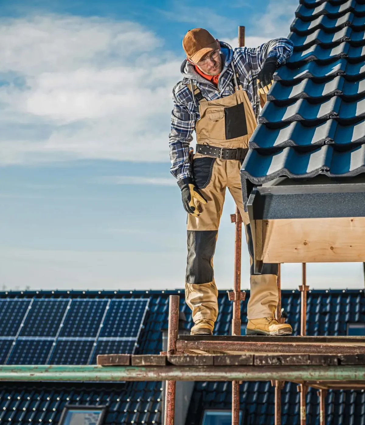 house-roof-construction-2023-11-27-05-23-20-utc Commercial Roofing System: A professional roofer checking work quality on the roof